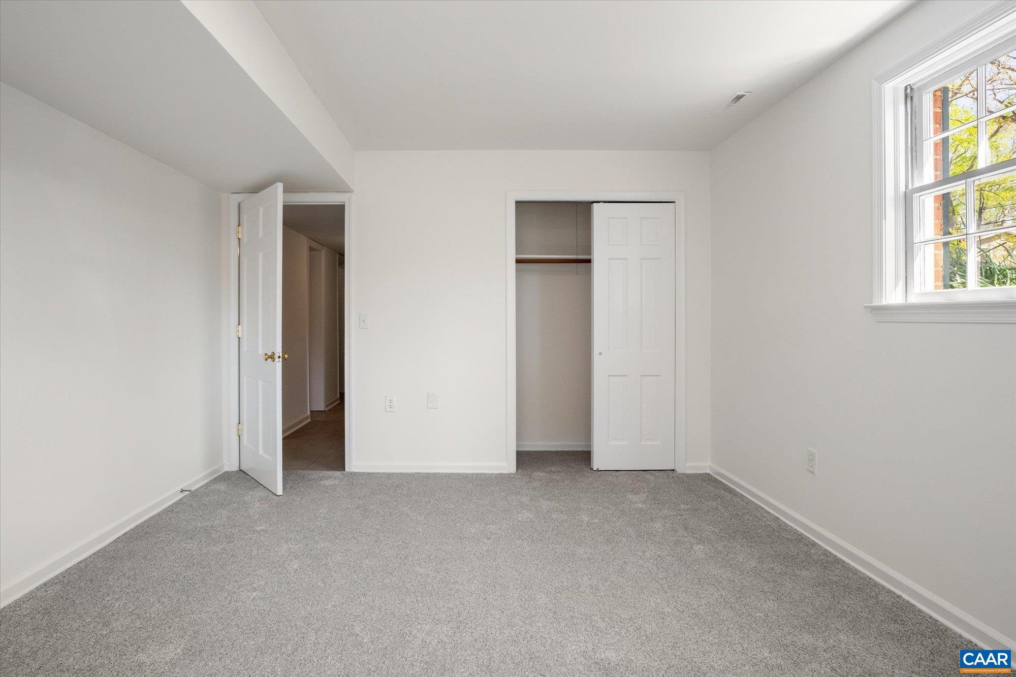 503 Carrsbrook Drive Charlottesville, VA 22901 - Photo 39 of 58 an empty room with windows and closet