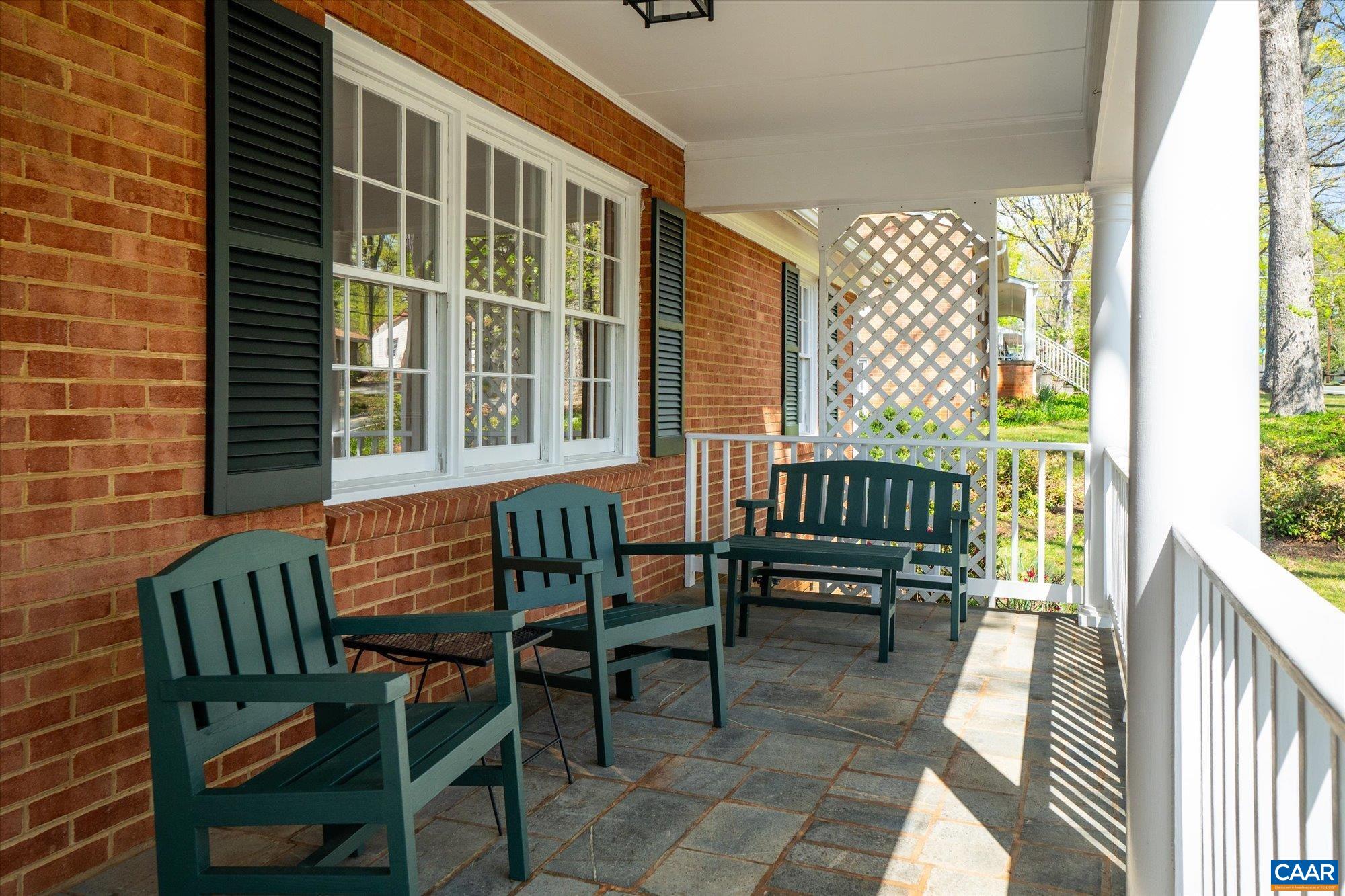 503 Carrsbrook Drive Charlottesville, VA 22901 - Photo 6 of 58 a balcony with table and chairs and potted plants