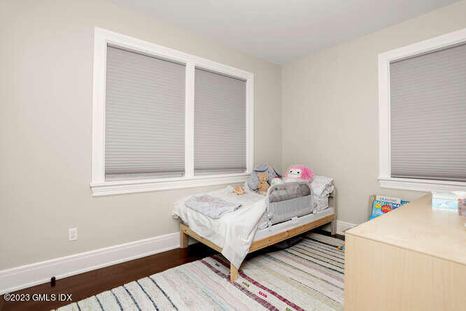 19 Crawford Terrace Riverside, CT 06878 - Photo 11 of 26 a bedroom with a bed and a window