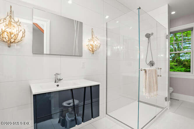 19 Crawford Terrace Riverside, CT 06878 - Photo 12 of 26 a bathroom with a sink and a mirror