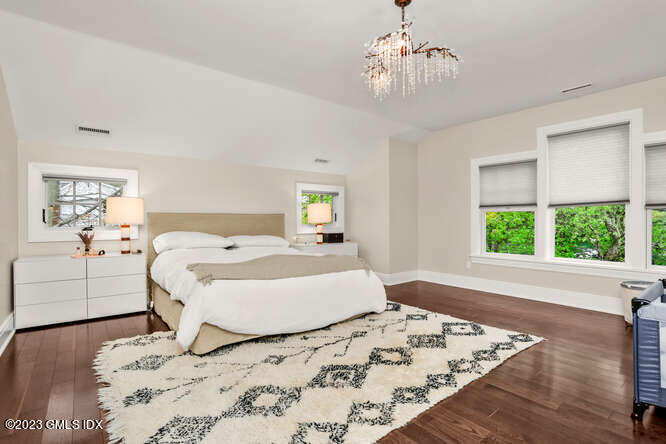 19 Crawford Terrace Riverside, CT 06878 - Photo 13 of 26 a bedroom with a bed and a window