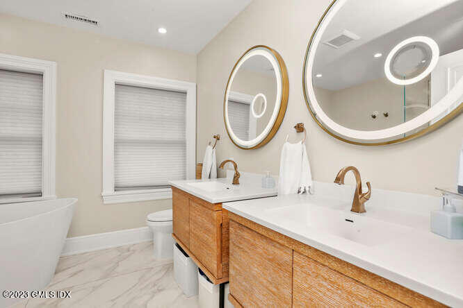 19 Crawford Terrace Riverside, CT 06878 - Photo 15 of 26 a bathroom with a sink and a mirror