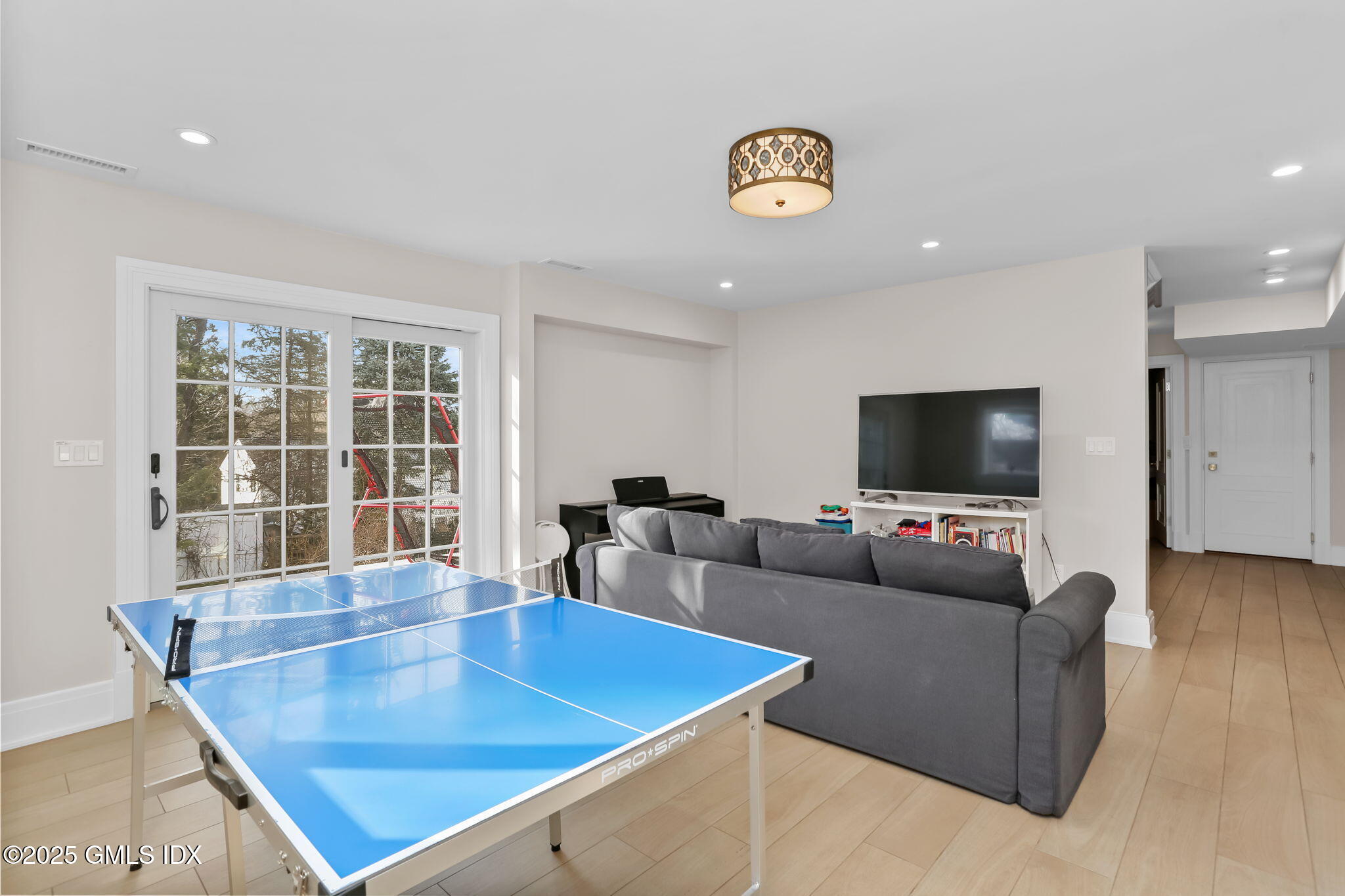 19 Crawford Terrace Riverside, CT 06878 - Photo 17 of 26 a living room with furniture and a flat screen tv
