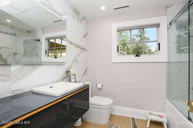 19 Crawford Terrace Riverside, CT 06878 - Photo 20 of 26 a bathroom with a sink a toilet and a window