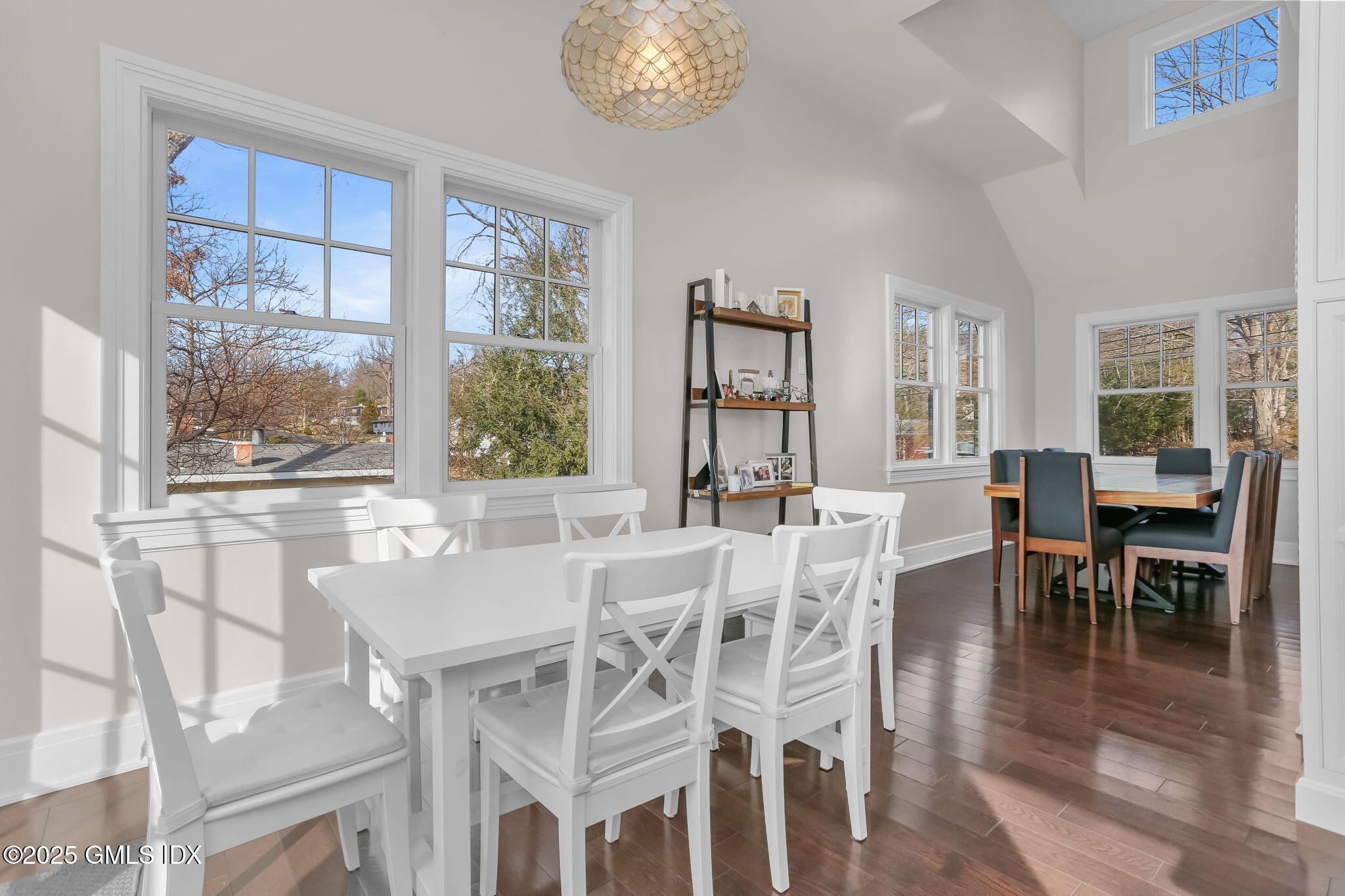 19 Crawford Terrace Riverside, CT 06878 - Photo 5 of 26 a view of a dining room with furniture large windows and wooden floor