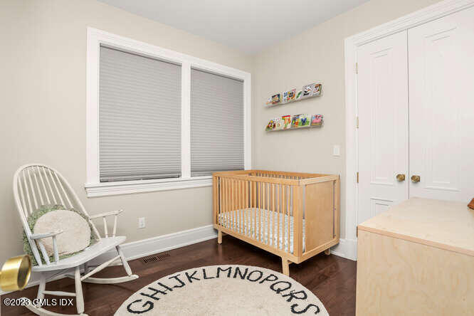 19 Crawford Terrace Riverside, CT 06878 - Photo 10 of 26 a bedroom with a bed and a window