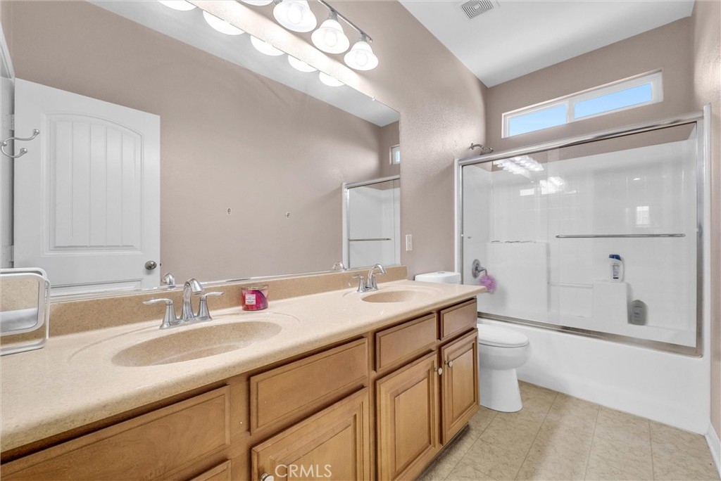 18388 Hidden Ranch Road Riverside, CA 92508 - Photo 37 of 46 a bathroom with a granite countertop sink mirror and double