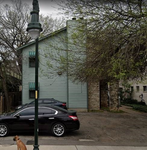 View of property exterior with a chimney