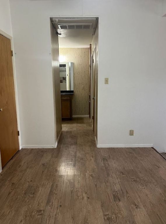 2813 1/2 Rio Grande Street, Unit 5 Austin, TX 78701 - Photo 11 of 21 Hallway featuring dark wood-style floors