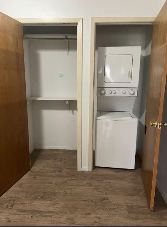 2813 1/2 Rio Grande Street, Unit 5 Austin, TX 78701 - Photo 14 of 21 Laundry area featuring dark wood-style flooring and stacked washer and clothes dryer