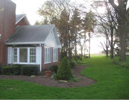 Exterior Front. Side yard / Sun Porch / Back field