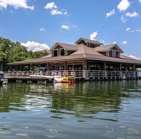 a front view of a house with a lake view