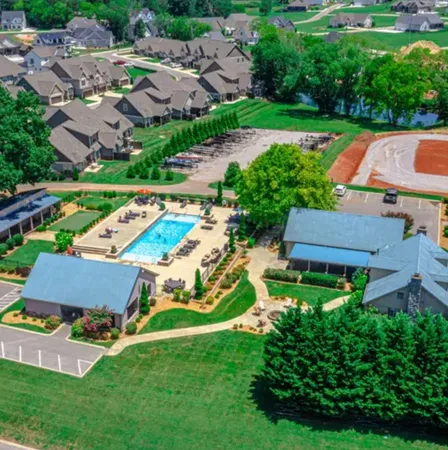 an aerial view of a house with garden space and street view