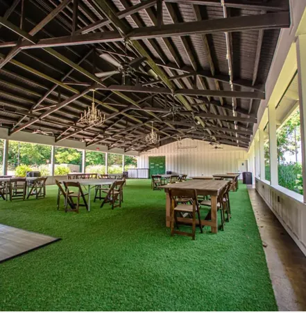 a view of a big room with table and chairs