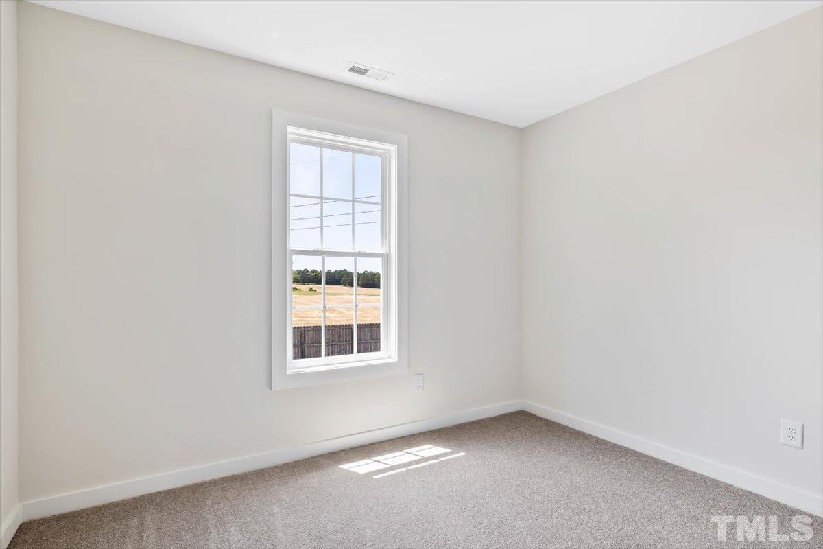 2075 Highway 55 Coats, NC 27521 - Photo 13 of 24 an empty room with a window