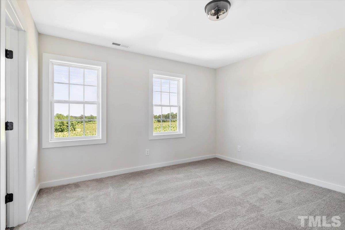 2075 Highway 55 Coats, NC 27521 - Photo 17 of 24 an empty room with windows