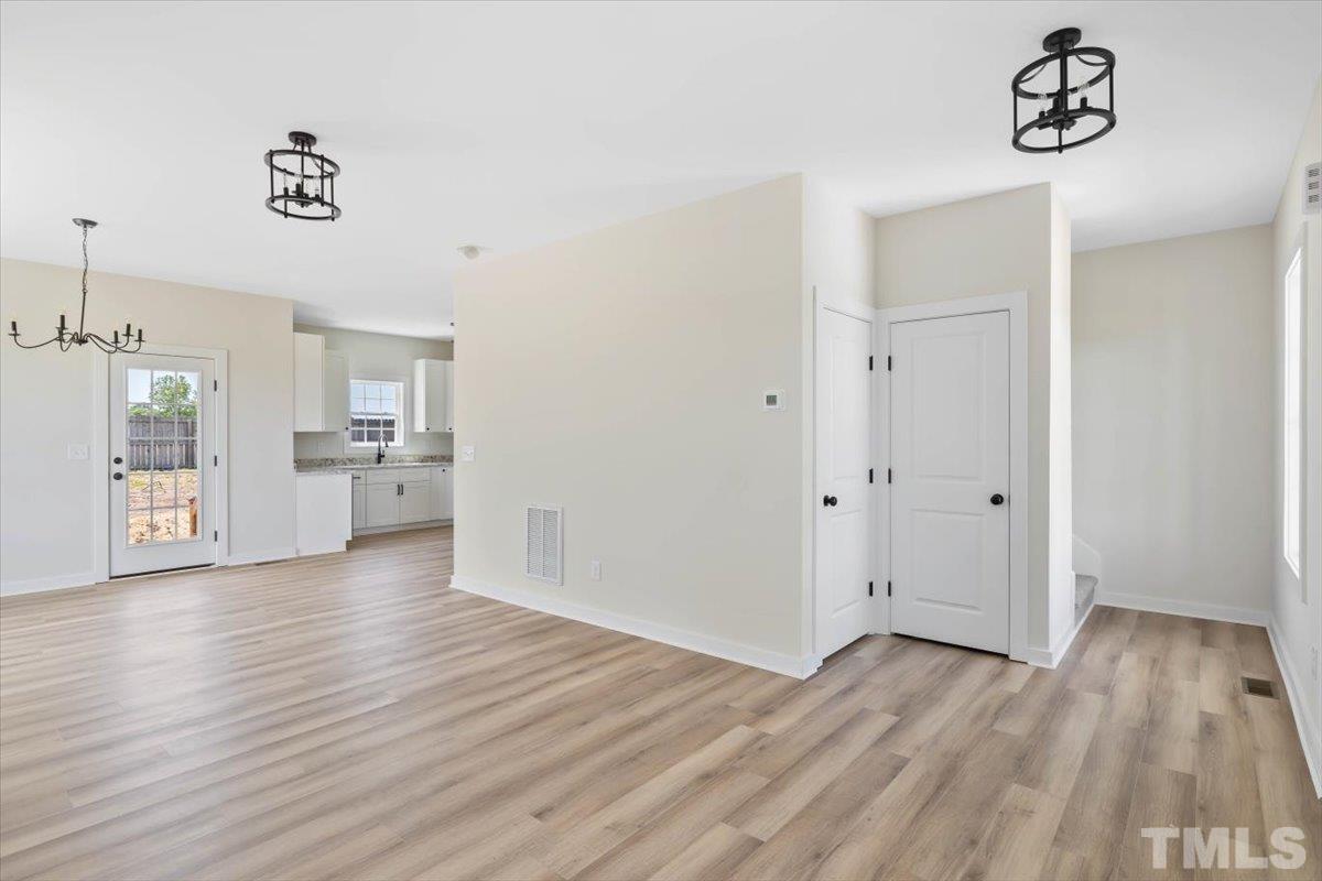 2075 Highway 55 Coats, NC 27521 - Photo 4 of 24 a view of empty room with wooden floor