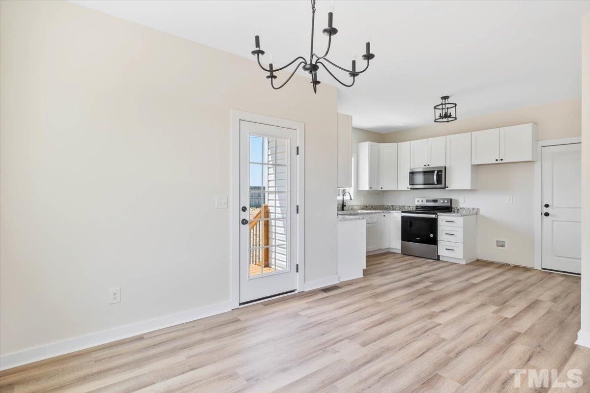 2075 Highway 55 Coats, NC 27521 - Photo 6 of 24 a view of kitchen with sink microwave and stove