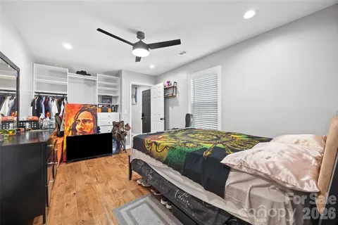 a bed room with a bed and a walk in closet