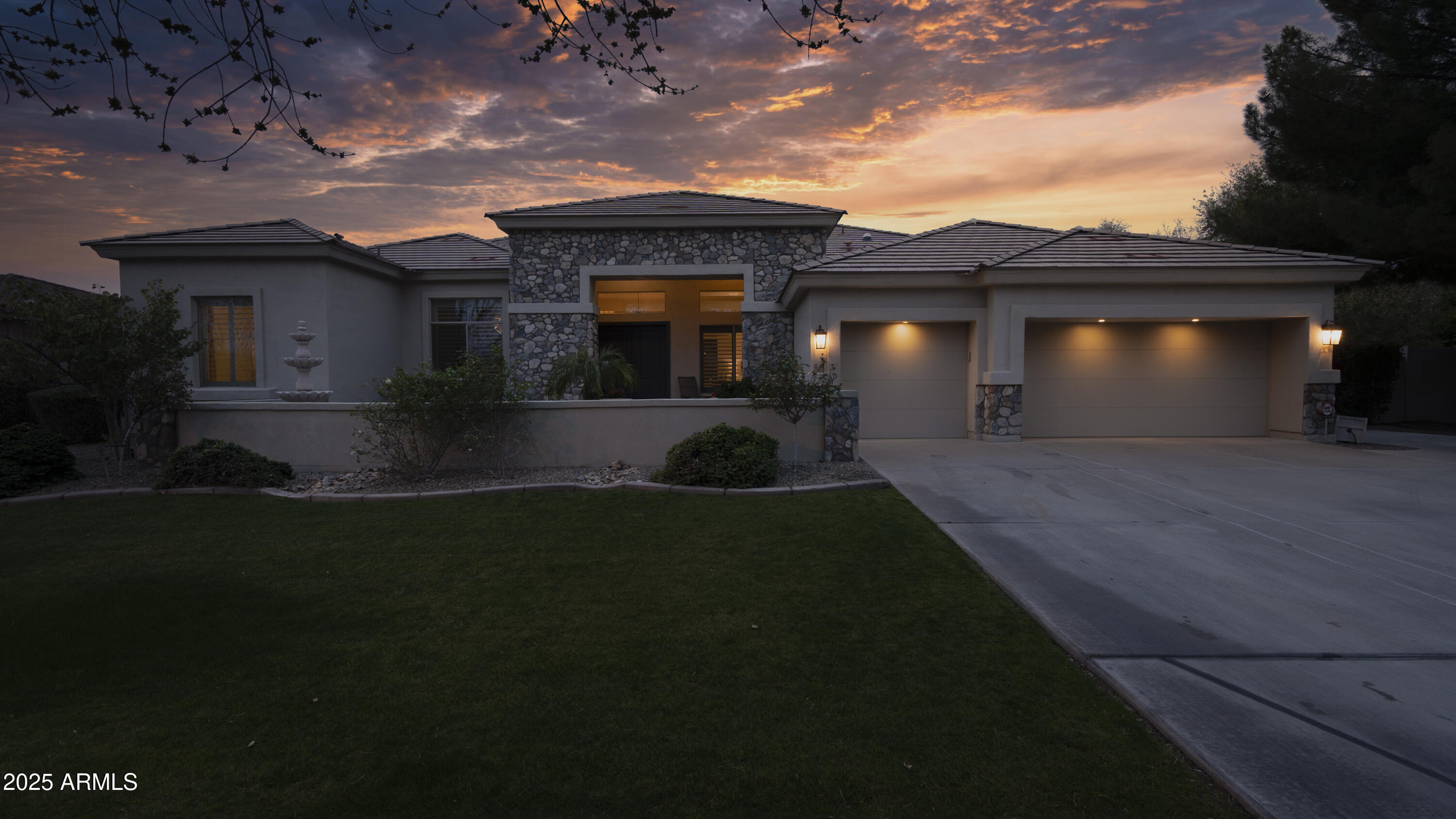 56 South Prairie Road Gilbert, AZ 85296 - Photo 54 of 59 a front view of a house with a yard and garage