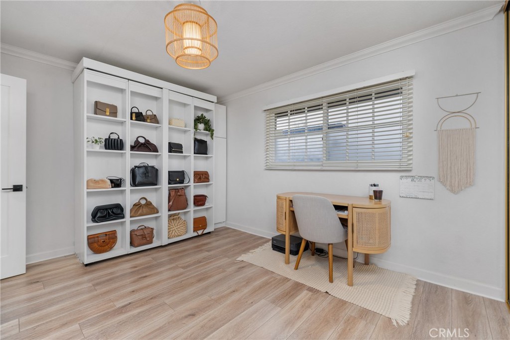 417 Gloucester Drive Costa Mesa, CA 92627 - Photo 17 of 29 a view of a chair and wooden floor in a room