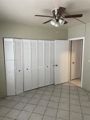 a view of an empty room and entryway