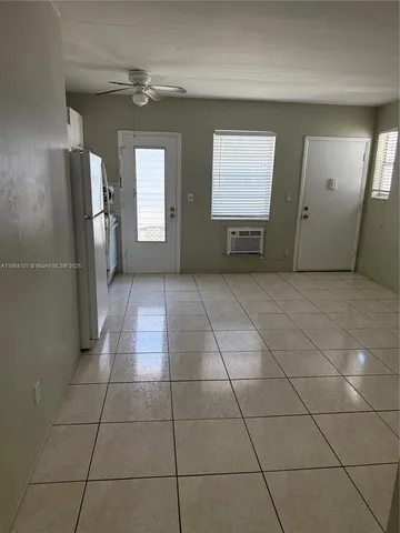 a view of empty room with windows