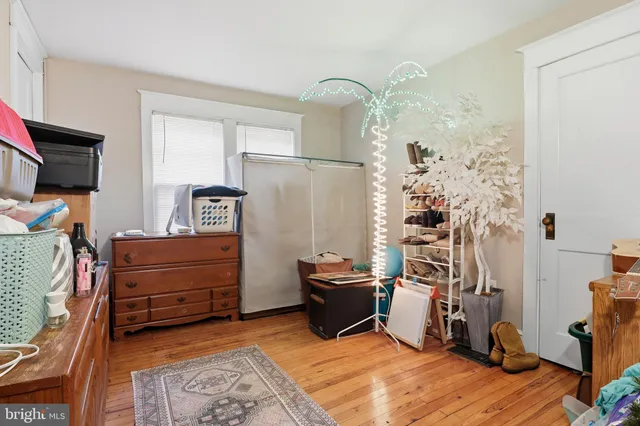 a bedroom with furniture and a flat tv screen