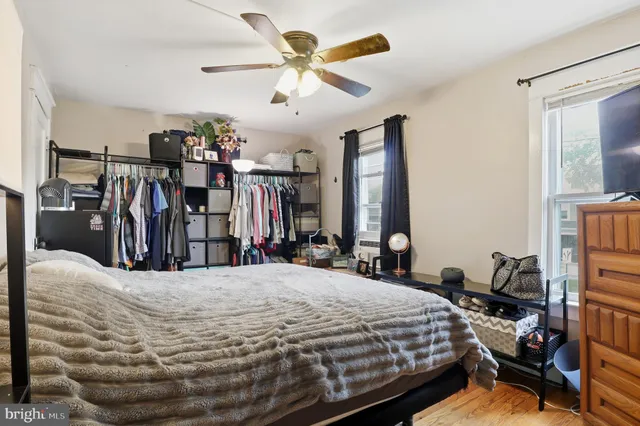 a bed room with a bed and a large mirror