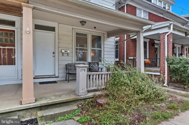 a front view of a house with a porch