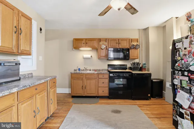 a kitchen with stainless steel appliances granite countertop a stove and a sink