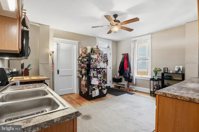 a view of a kitchen with a sink and a stove