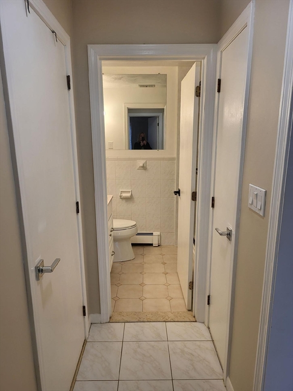 1 Hallmark Gardens, Unit 1 Burlington, MA 01803 - Photo 11 of 14 a view of a hallway and a livingroom with a bathroom