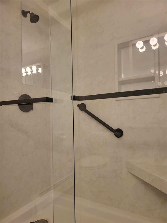 1 Hallmark Gardens, Unit 1 Burlington, MA 01803 - Photo 12 of 14 a bathroom with a shower and a mirror