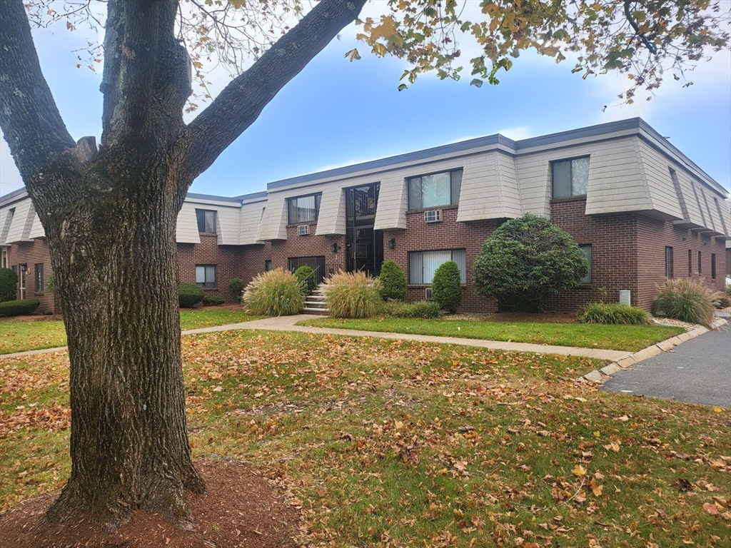 1 Hallmark Gardens, Unit 1 Burlington, MA 01803 - Photo 2 of 14 a house view with a outdoor space