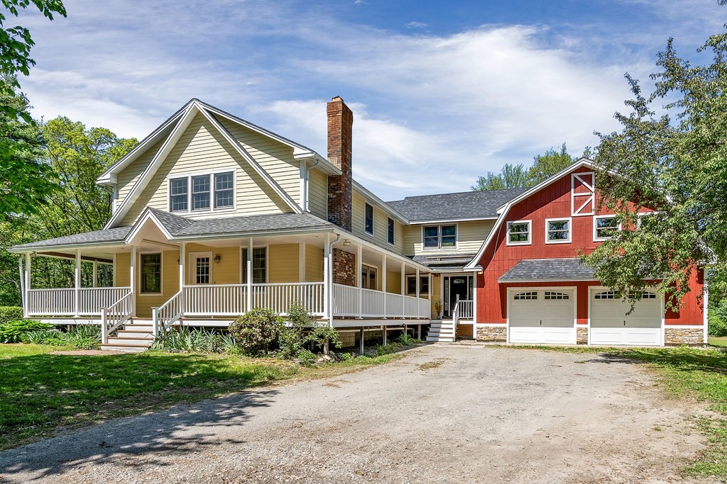 236 Gates Pond Road Berlin, MA 01503 - Photo 1 of 42 a front view of a house with a yard