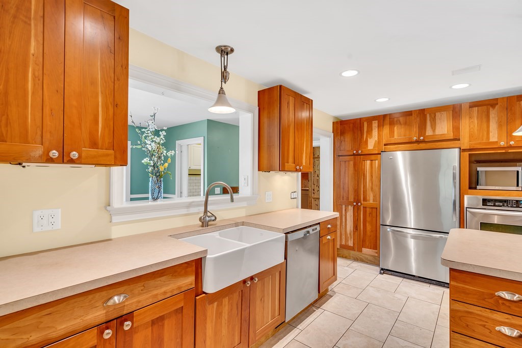 236 Gates Pond Road Berlin, MA 01503 - Photo 14 of 42 a kitchen with stainless steel appliances granite countertop a refrigerator a sink and a stove