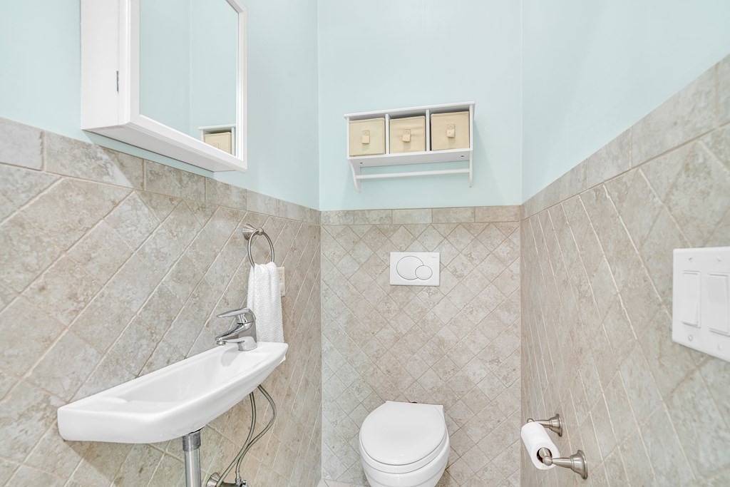236 Gates Pond Road Berlin, MA 01503 - Photo 25 of 42 a bathroom with a toilet sink and mirror
