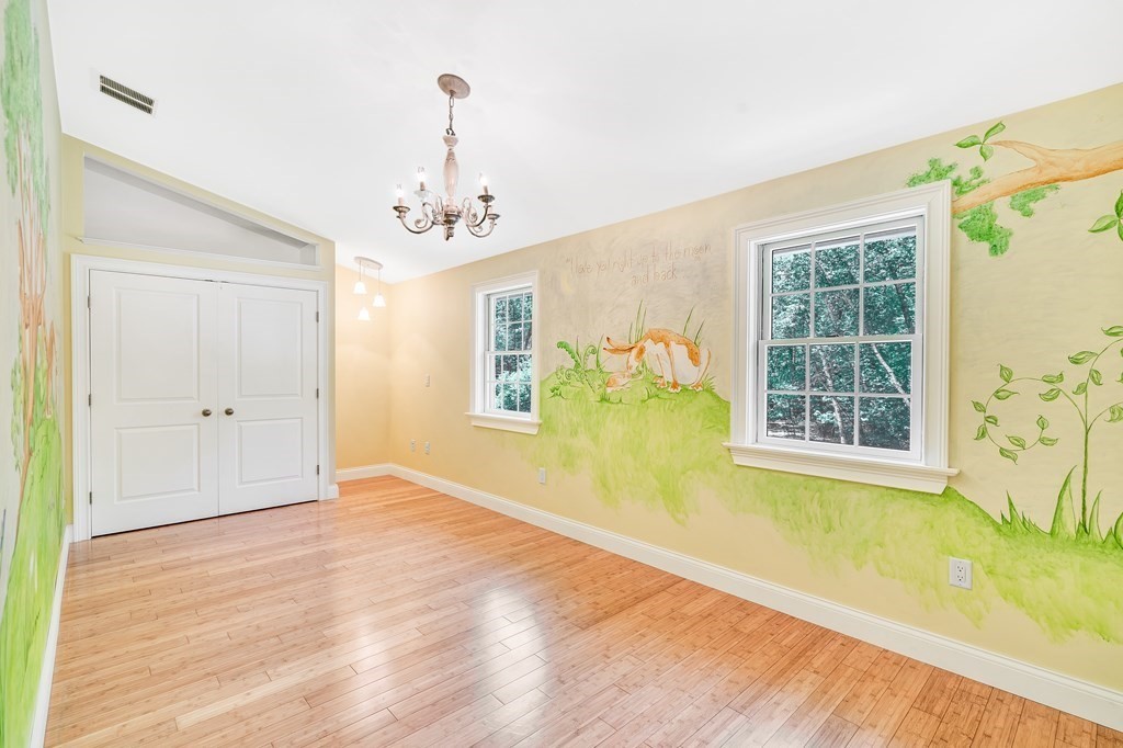 236 Gates Pond Road Berlin, MA 01503 - Photo 26 of 42 a view of an empty room with a window and wooden floor