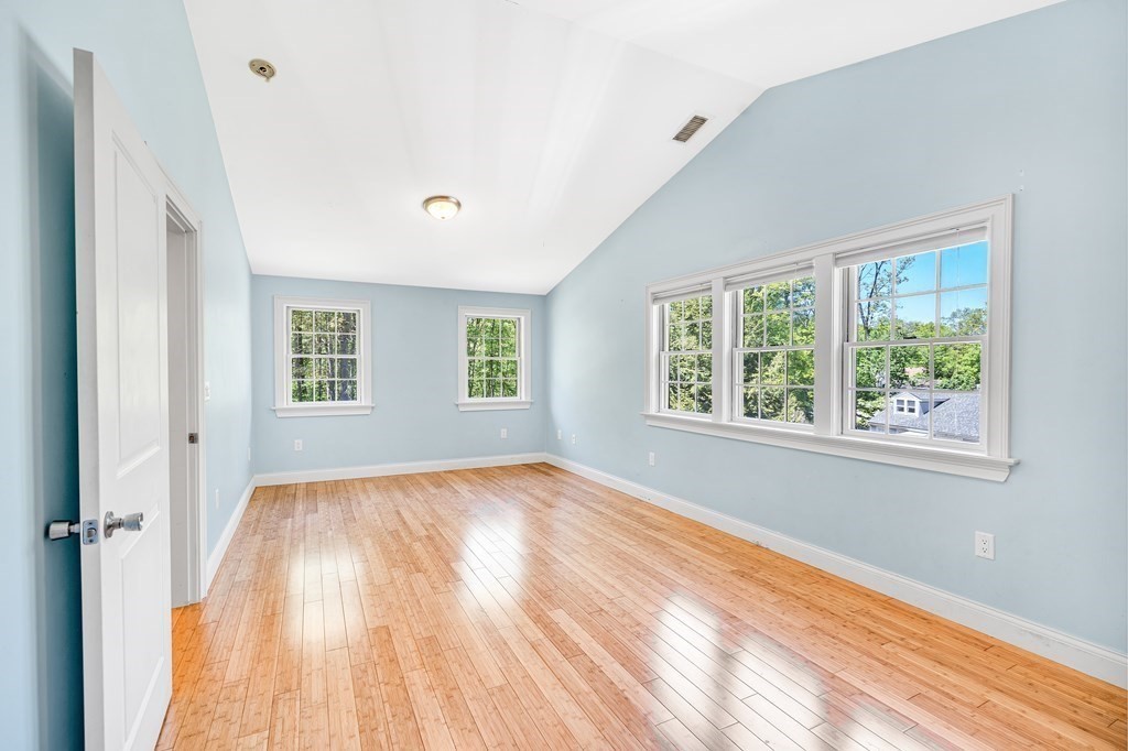 236 Gates Pond Road Berlin, MA 01503 - Photo 28 of 42 a view of an empty room with wooden floor and a window