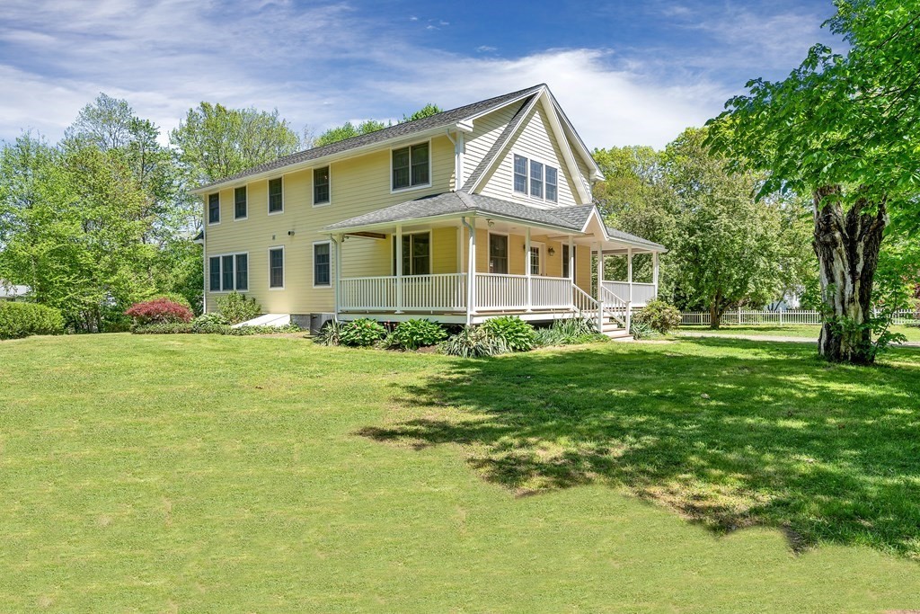 236 Gates Pond Road Berlin, MA 01503 - Photo 3 of 42 a front view of a house with a yard