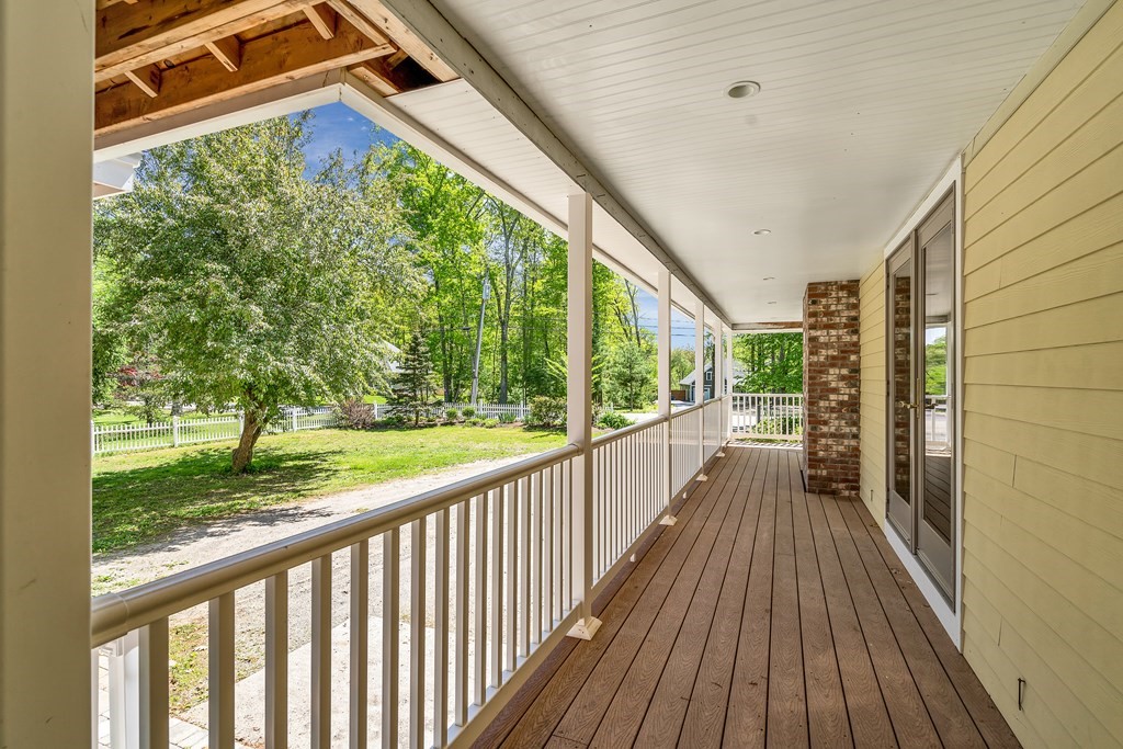 236 Gates Pond Road Berlin, MA 01503 - Photo 4 of 42 a view of a room with wooden floor and deck