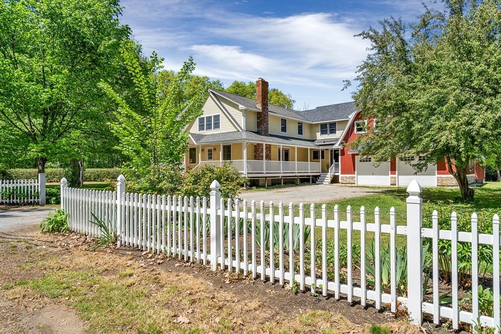 236 Gates Pond Road Berlin, MA 01503 - Photo 5 of 42 a front view of a house with a garden