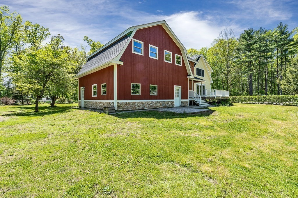 236 Gates Pond Road Berlin, MA 01503 - Photo 6 of 42 a view of a house with a yard