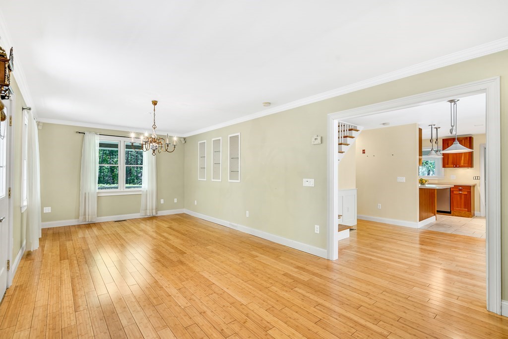 236 Gates Pond Road Berlin, MA 01503 - Photo 9 of 42 a view of a livingroom with wooden floor and a window
