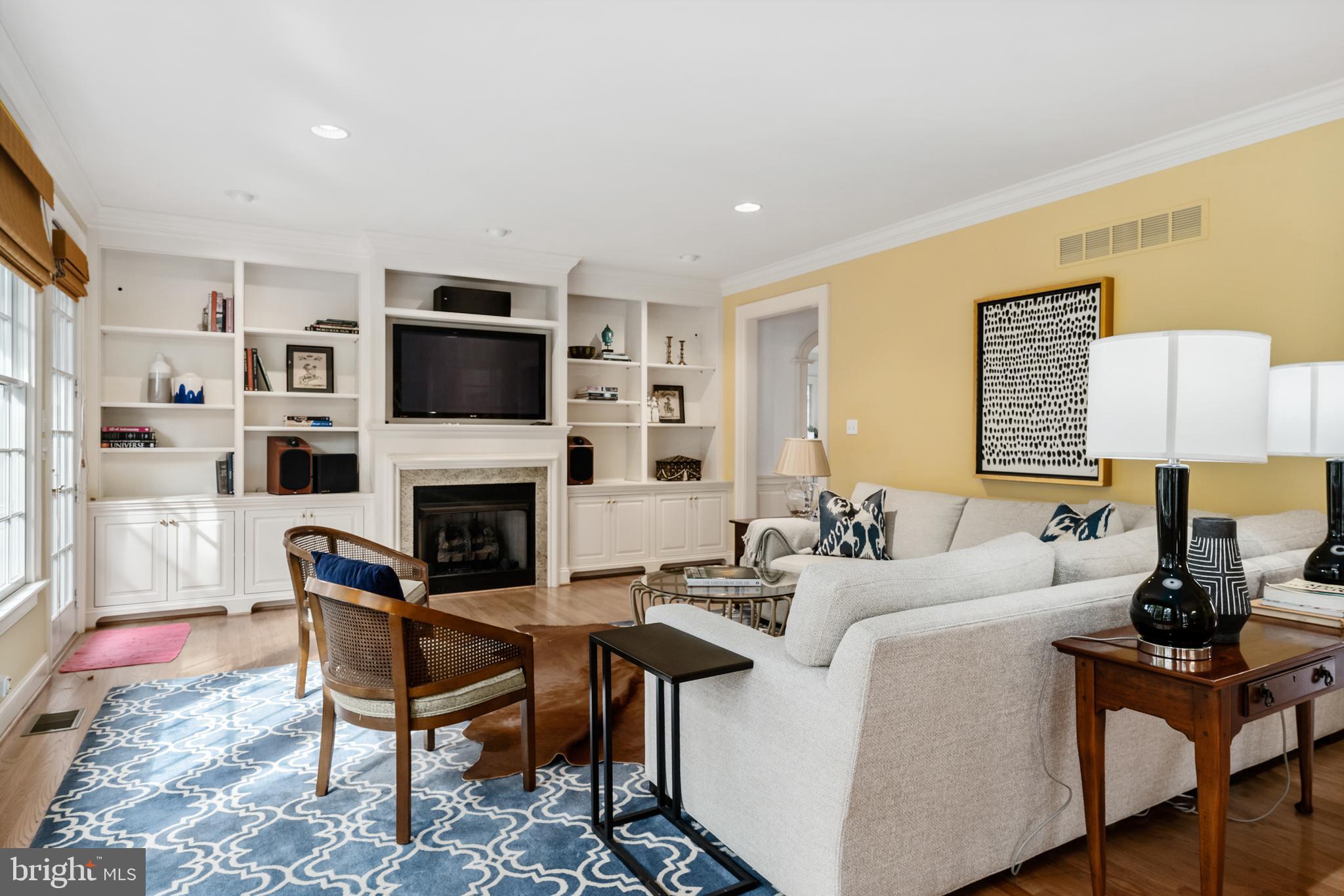 809 Matlack Drive Moorestown, NJ 08057 - Photo 20 of 67 a living room with furniture a fireplace and a flat screen tv