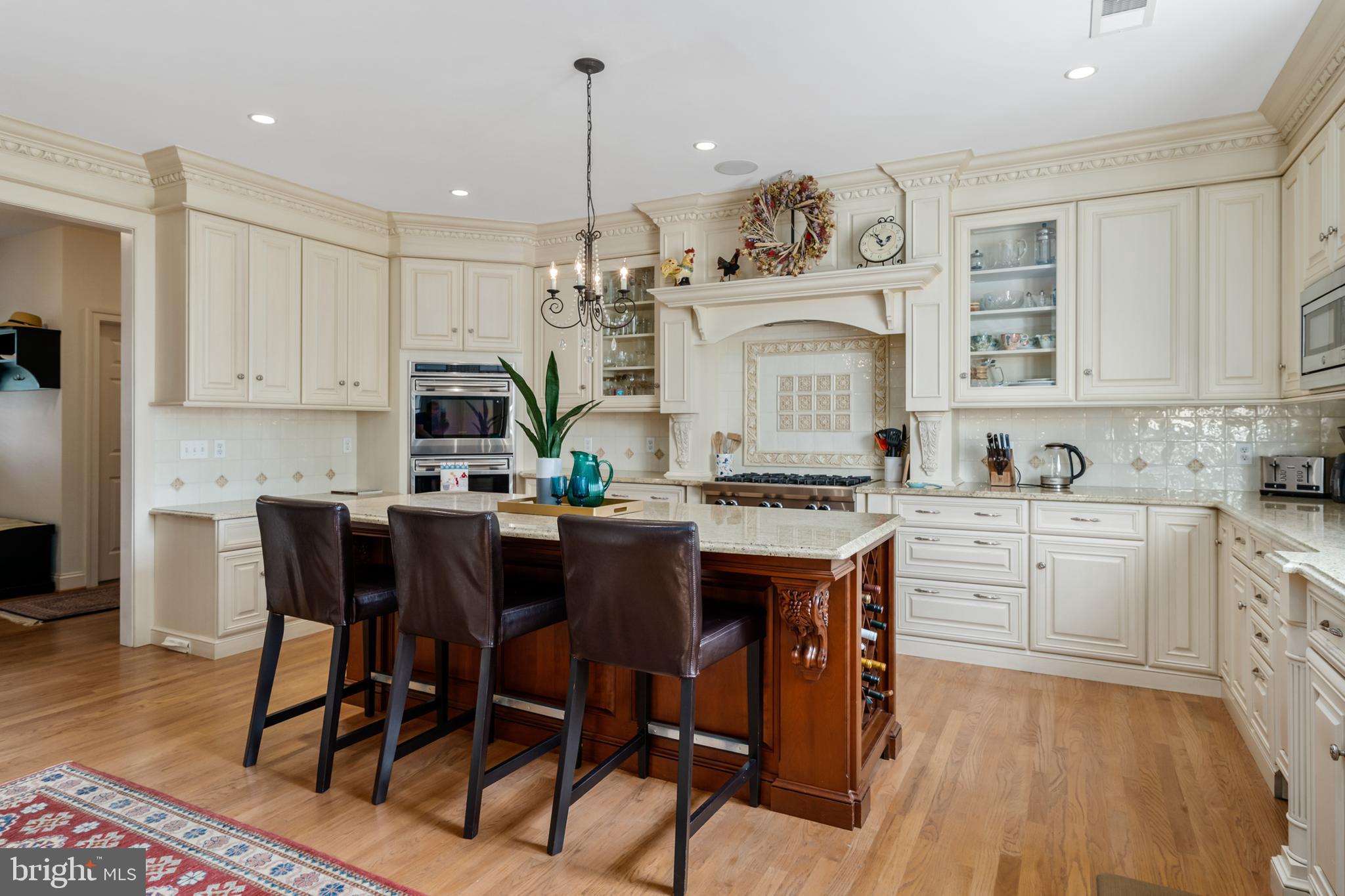 809 Matlack Drive Moorestown, NJ 08057 - Photo 24 of 67 a kitchen with stainless steel appliances granite countertop a white cabinets and wooden floor