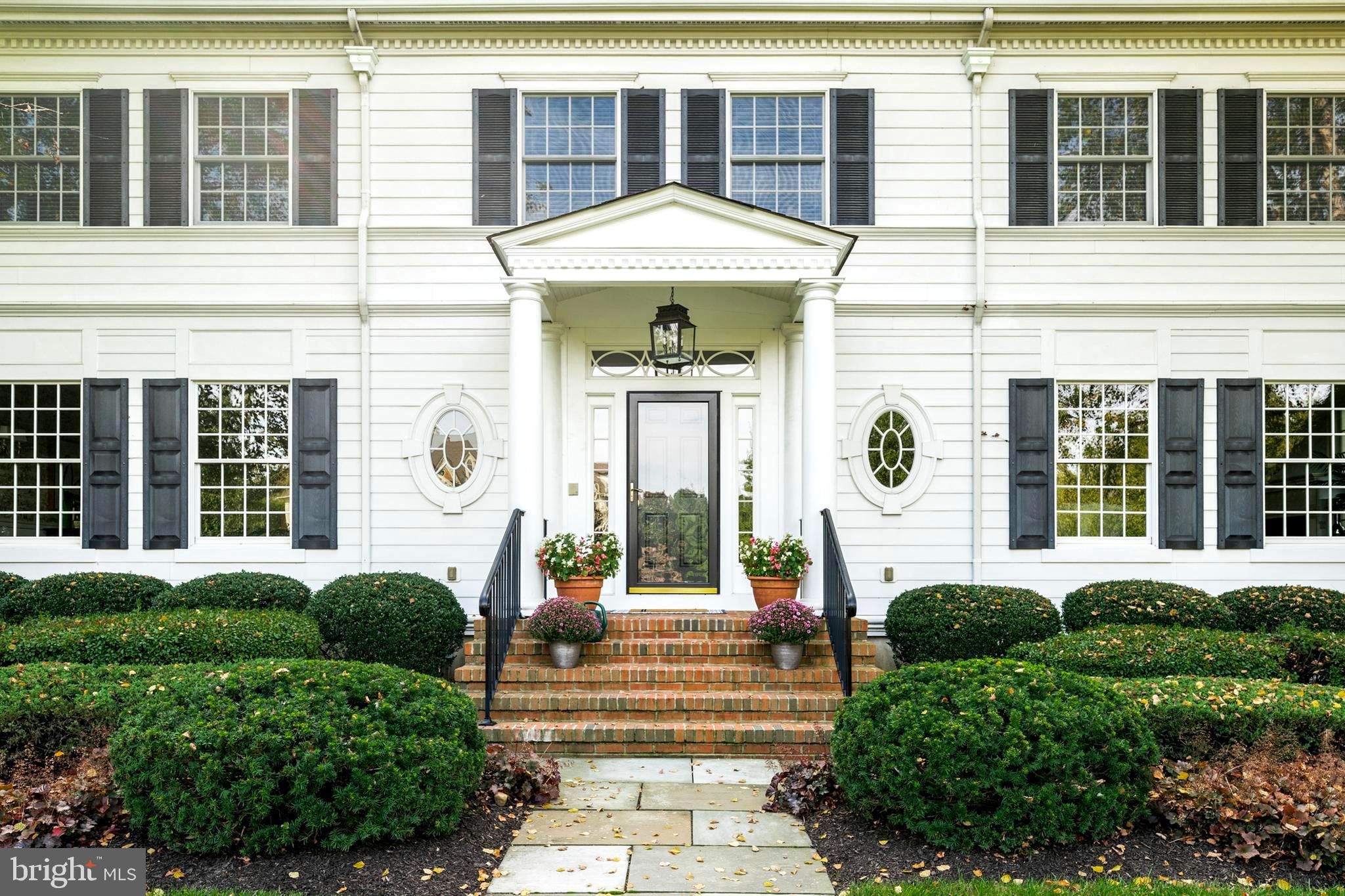 809 Matlack Drive Moorestown, NJ 08057 - Photo 4 of 67 a front view of a house with a lots of windows and plants