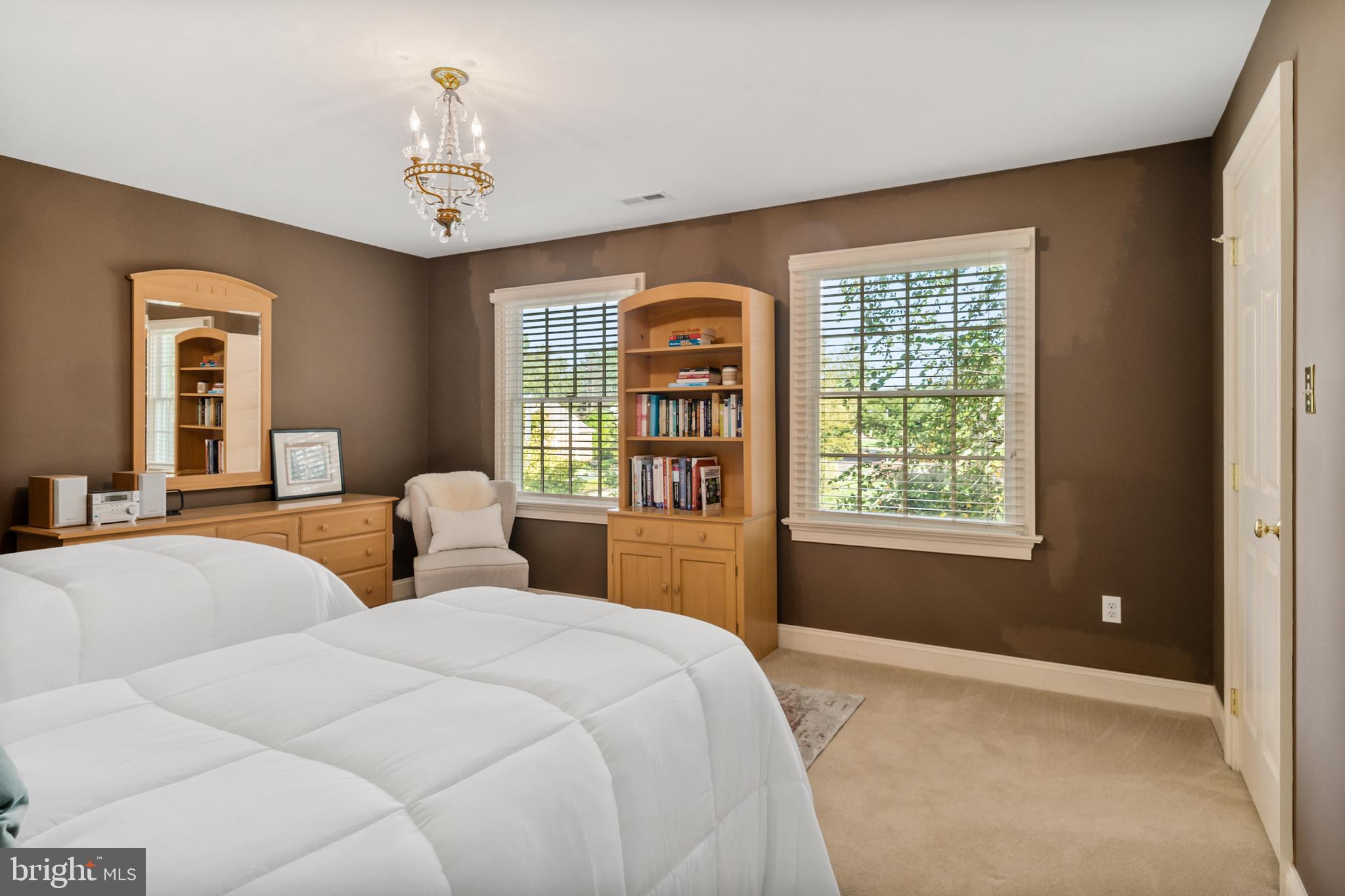 809 Matlack Drive Moorestown, NJ 08057 - Photo 41 of 67 a bedroom with two beds and a chandelier