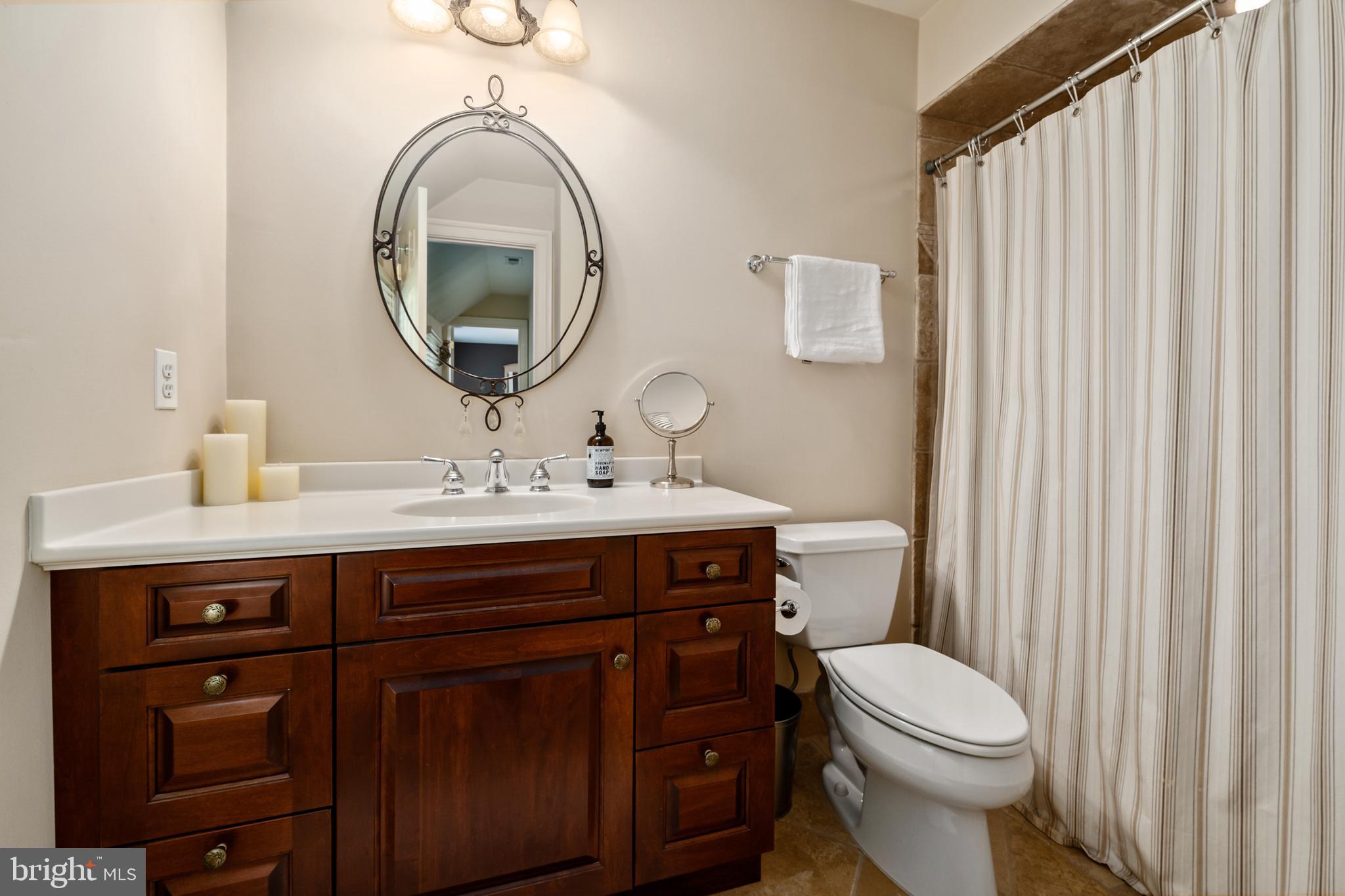 809 Matlack Drive Moorestown, NJ 08057 - Photo 42 of 67 a bathroom with a toilet a sink and a mirror